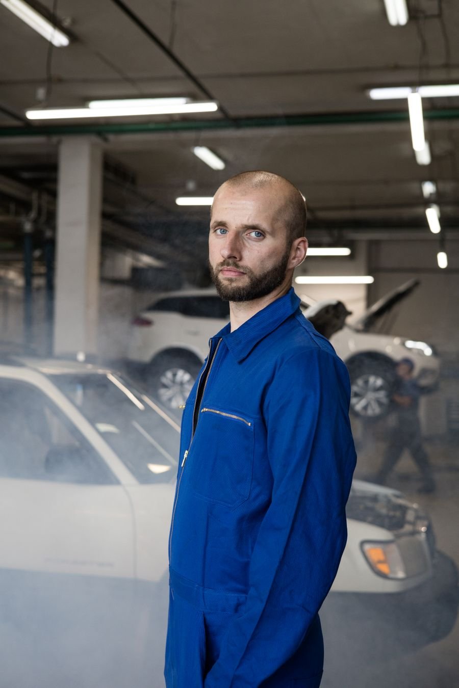Technician in the car care workshop bay